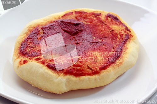 Image of Small pizza (pizzette) on plate