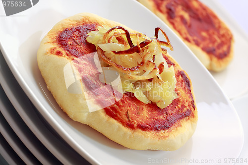 Image of Simple small pizza (pizzette) with onion