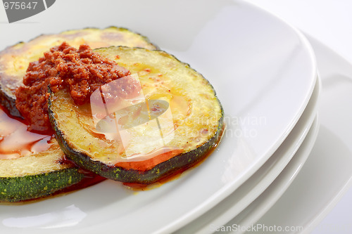Image of Fried slices of courgette with sauce