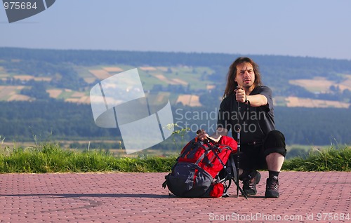 Image of Crouching tourist