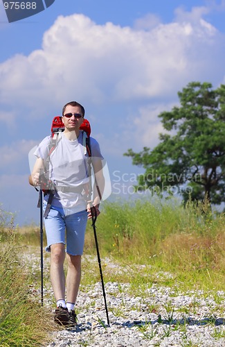 Image of Walking hiker on stony path