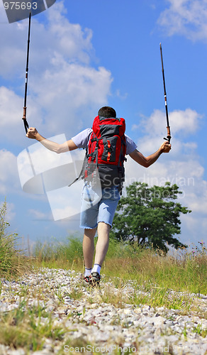 Image of Hiker on stony footpath