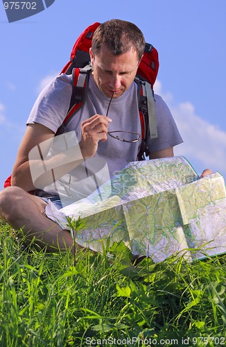 Image of Tourist looking on map