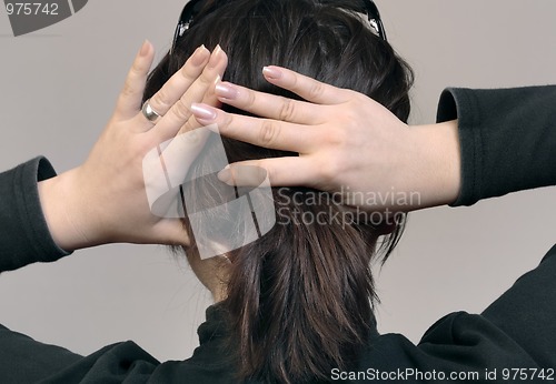 Image of Female hands and head from back