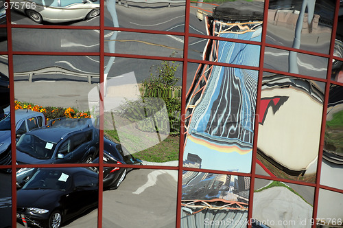 Image of Distorted Reflection of Cars and Buildings