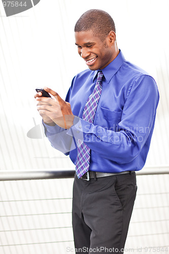 Image of Black businesswoman texting