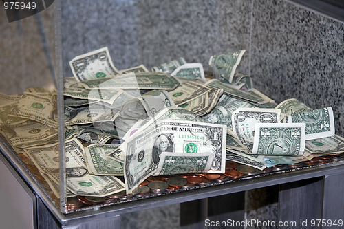 Image of Money in a donation box