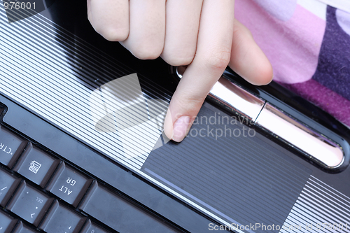 Image of Working at laptop .