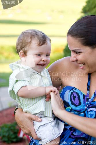 Image of Happy Mother Holding Her Baby