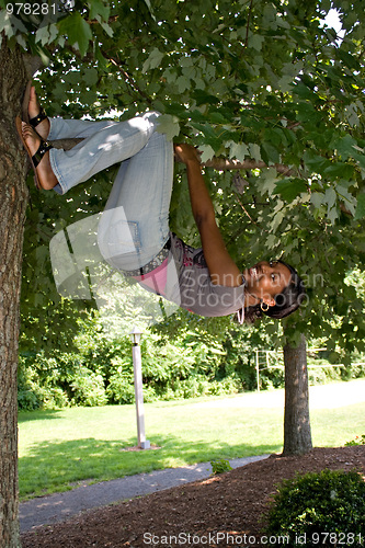 Image of Woman Hanging from a Tree