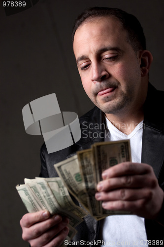 Image of Man Counting Money