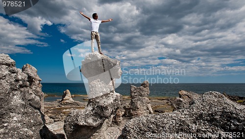 Image of Boy with arms rasied