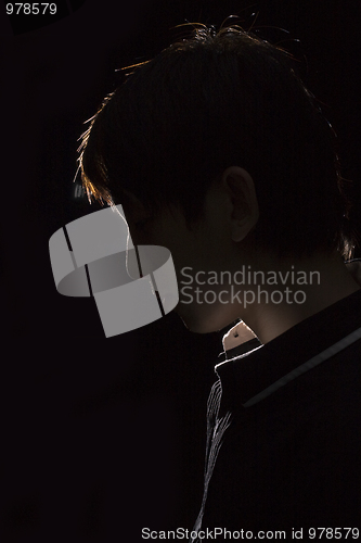 Image of Portrait of an Asian man in the darkness 