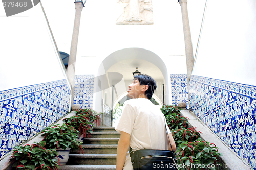 Image of asia man walking to church