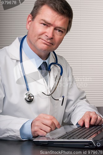 Image of Friendly doctor smiles at camera