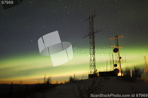 Image of Aurora Borealis and twilight over antenna complex