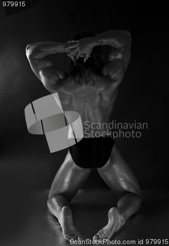 Image of  Dramatic image of a beautifully sculpted bodybuilder