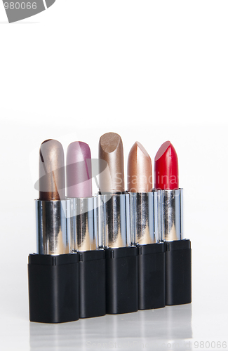 Image of multicolored lipsticks isolated on white