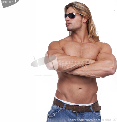 Image of Athletic sexy male body builder with the blonde long hair. gladi