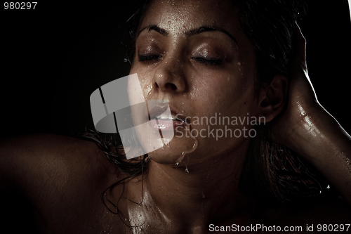 Image of Portrait of beautiful young woman with wet face