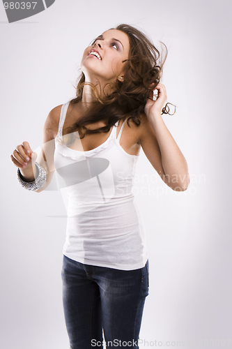 Image of isolated nice woman on jeans and white tanktop