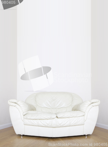 Image of White sofa in white room