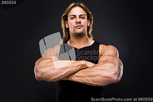 Image of Sexy muscular man isolated on black