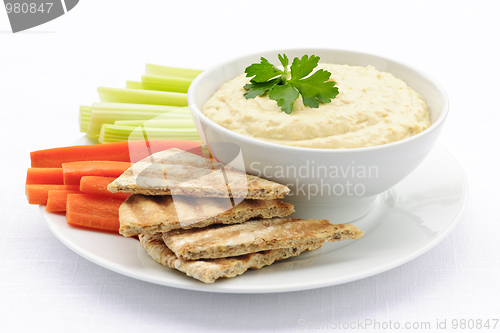 Image of Hummus with pita bread and vegetables