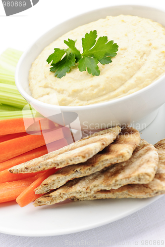 Image of Hummus with pita bread and vegetables