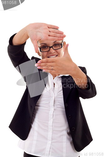 Image of woman looks through a hand frame