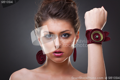 Image of woman wearing leather jewlery