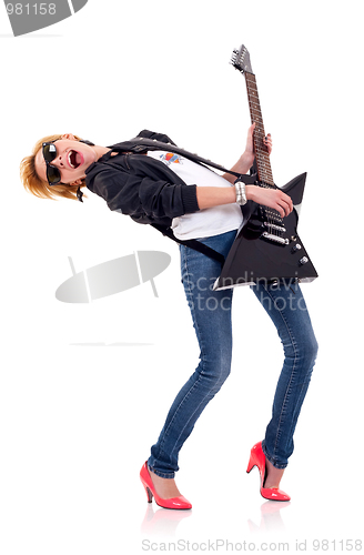 Image of blond girl playing her electric guitar 