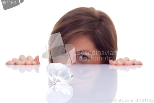 Image of woman looking at a big diamond