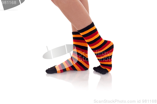 Image of woman legs in strip socks