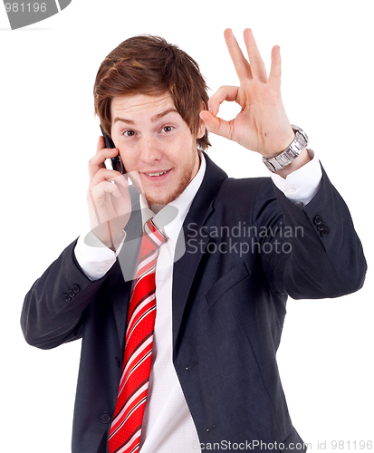 Image of man on the phone approving 