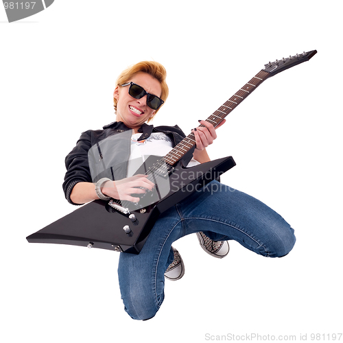 Image of woman guitarist playing on her knees