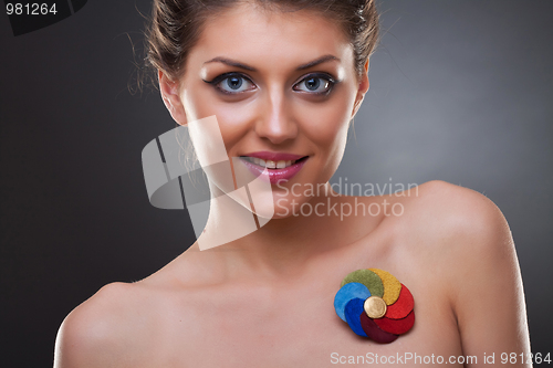 Image of beautiful woman wearing a brooch