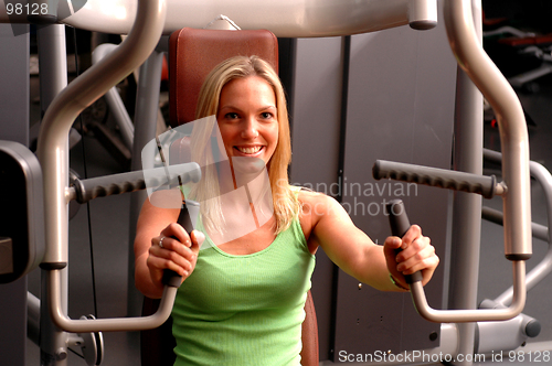 Image of beautiful woman in fitness gym