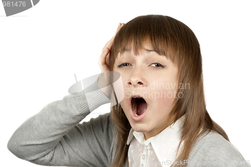 Image of Young beautiful girl yawns