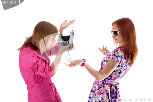 Image of Two girls are taken pictures