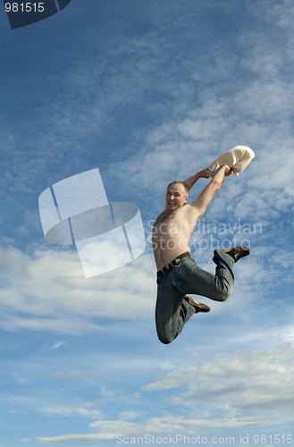 Image of Man jumps on background sky