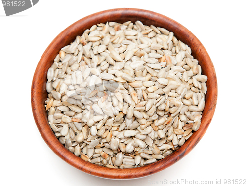 Image of Brown wooden cup with seed