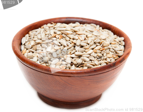 Image of Brown wooden cup with seed