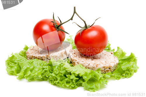 Image of Two ripe tomatoes and small loaf of bread