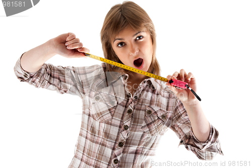 Image of Young beautiful girl with tape measure