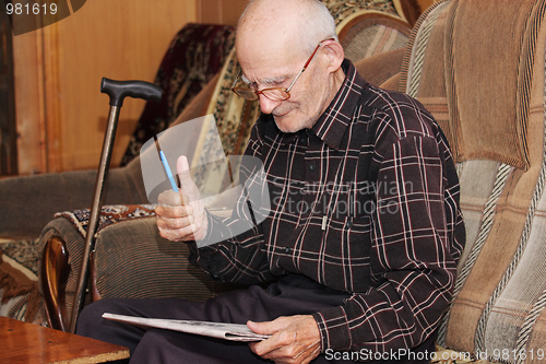 Image of Senior man gesturing thumb up