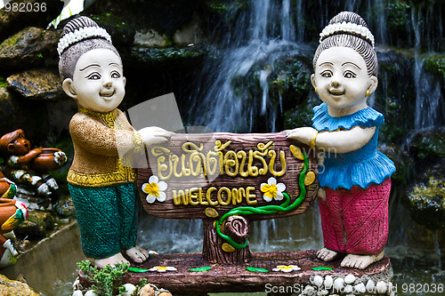 Image of Thai woman holds the sign You're welcome 