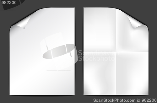 Image of Two sheets of white paper on dark background