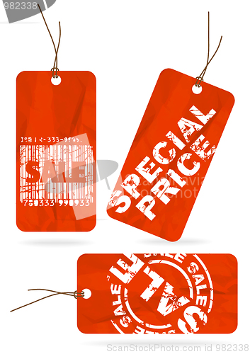 Image of Set of red crumpled sale paper tags