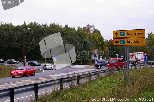 Image of a roundabout junction with heavy traffic